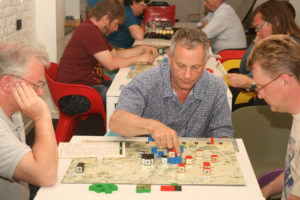 Carl, Keith, and Scott thinking and making manuevers while playing Napoleon by Columbia Games